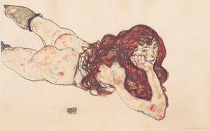 Femme nue allongée sur le ventre